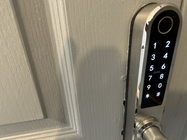 A door with a card reader and keypad. - Cosy Stay In Birmingham by Villazu (Birmingham)