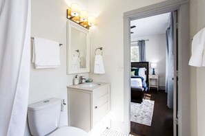 Combined shower/bathtub, hair dryer, towels, soap