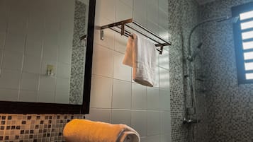 Shower, towels, soap, toilet paper