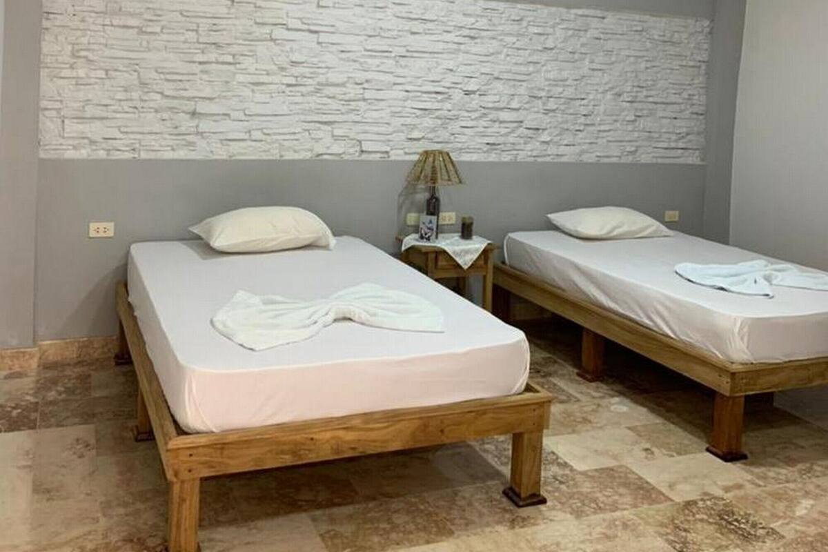 Family Quadruple Room | Minibar, individually decorated, individually furnished, blackout drapes