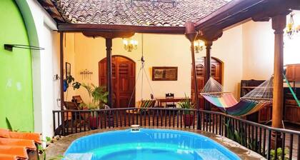 Youâll know that you have rented a historic colonial home when you pass through huge, antique front doors framed by 3 foot-thick adobe walls. Lounge on the shallow, submerged bench seats in the pool or in the hammocks hanging between 12 foot wooden c