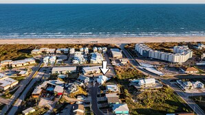 An aerial view of a coastal residential area with a beach in the background. - LaJuana Iguana by Silver Sands Vacation Rentals (Port Aransas)