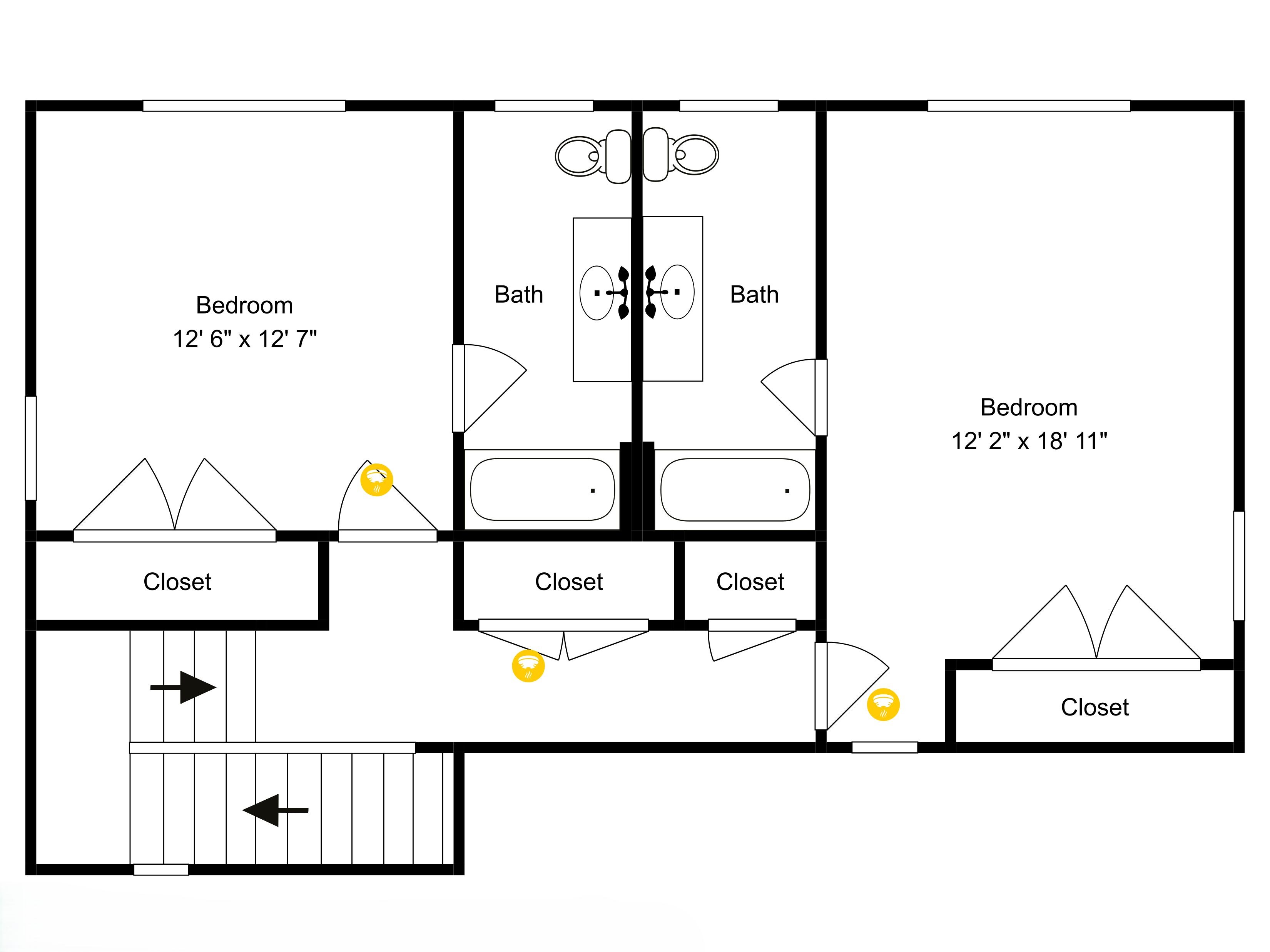 Un plan d’étage d’une chambre d’hôtel comprenant deux chambres, deux salles de bain et trois placards.