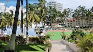 A resort pool area with palm trees, a water feature, and a building in the background. - Costa Vallarta by TRVL2HM (Nuevo Nayarit)