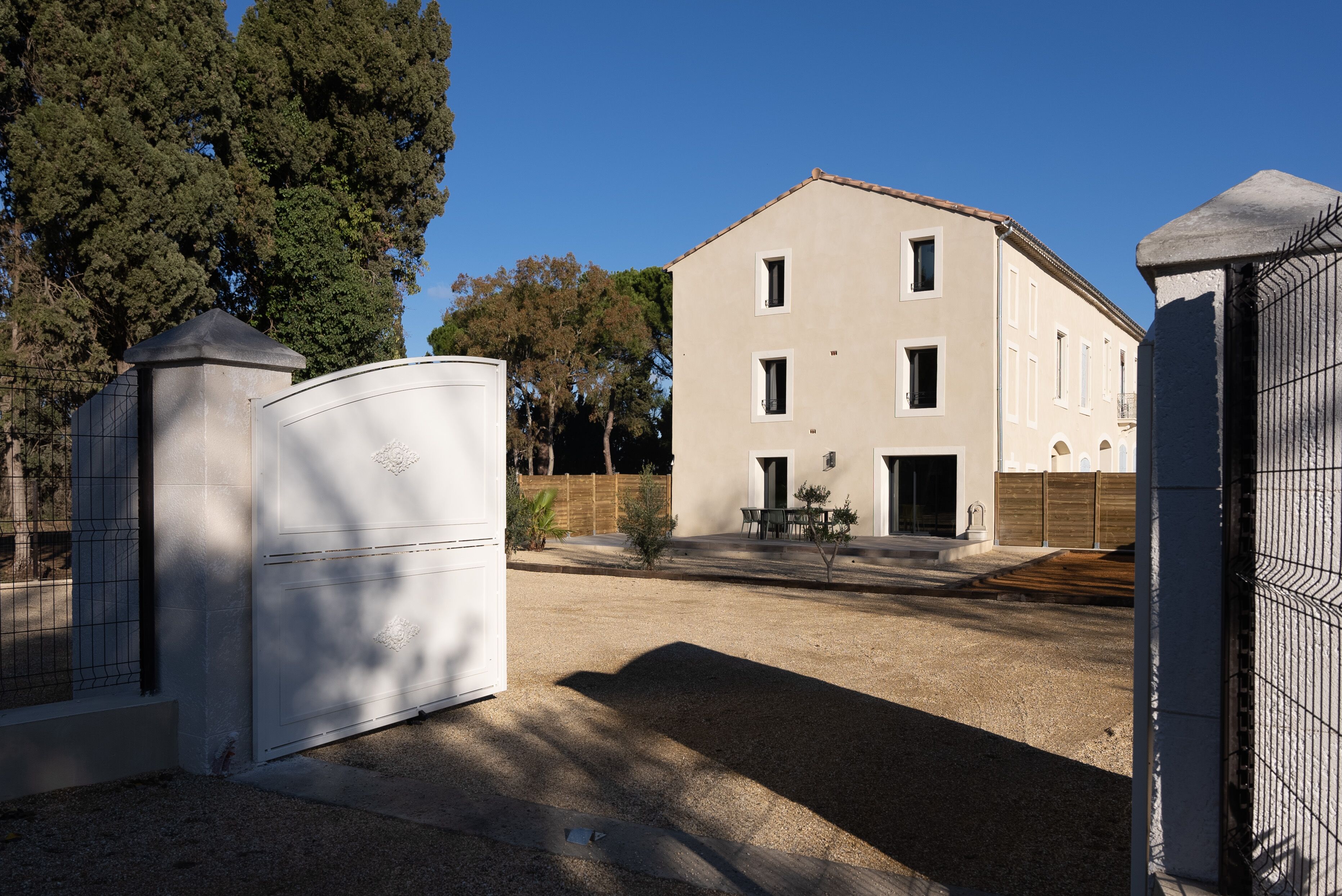 A building with a simple, rectangular structure, a flat roof, and a small front entrance.