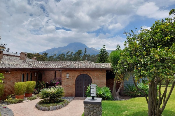 Entry to the house with volcano Imbabura in the background.