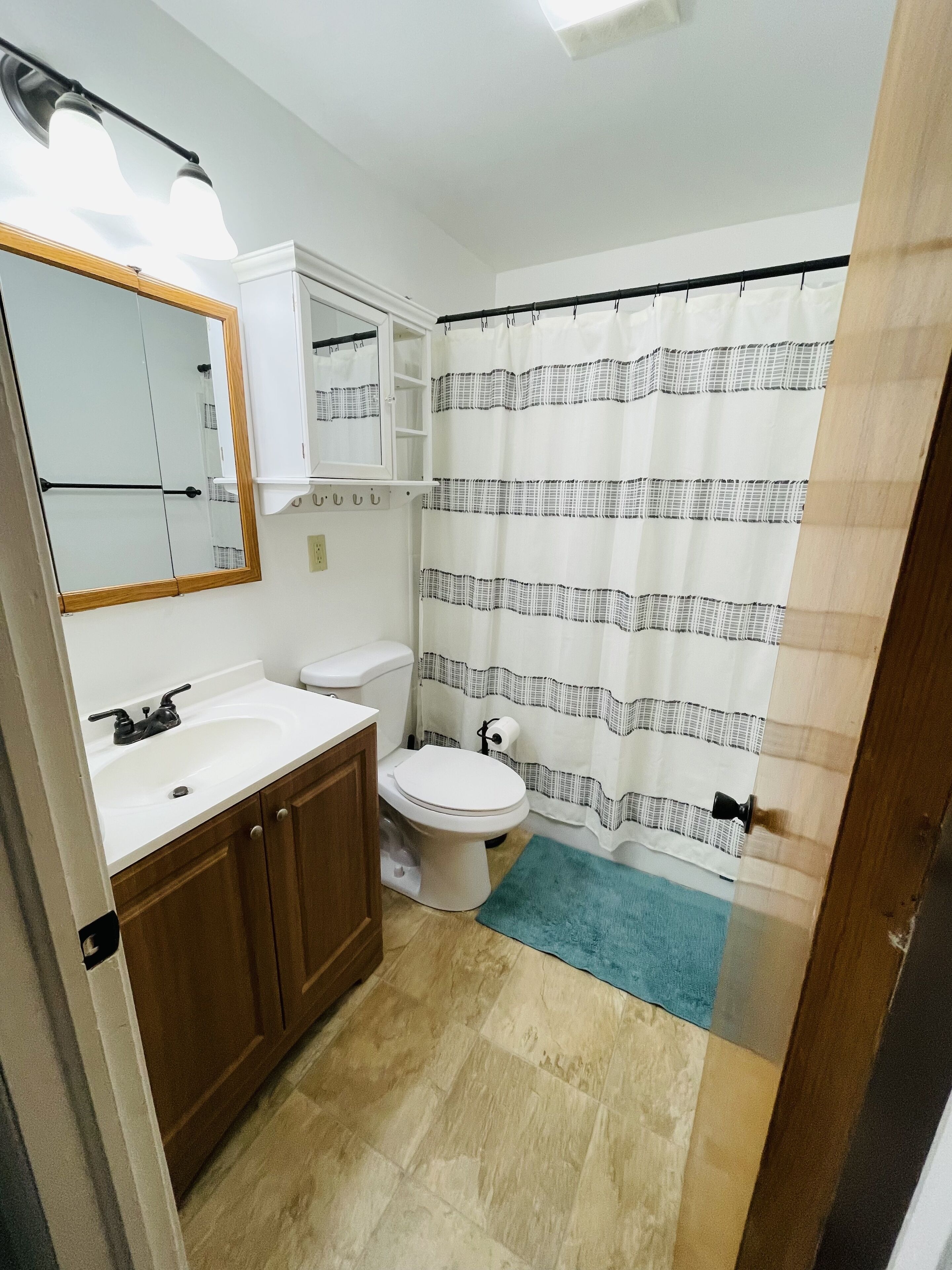 Bathtub, hair dryer, towels, soap