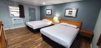 Family Room, 2 Bedrooms, Non Smoking | Free WiFi, bed sheets at Travelers Inn