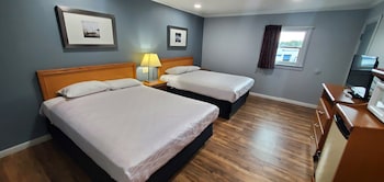 Family Room, 2 Bedrooms, Non Smoking | Free WiFi, bed sheets at Travelers Inn