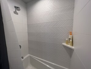 Combined shower/bathtub, hair dryer, towels, soap - Modern Home in Heart of West SEA (safer area), near Downtown, Beach, Hwy Access (Seattle)