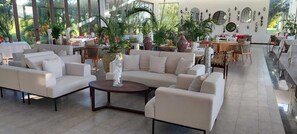 Relax in a spacious living area with comfortable seating and decorative touches.
