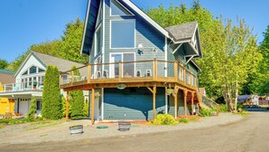 A two-story house with a balcony, a garage, and a driveway. - Cozy Mtn-View Haven 20 Mi to Olympic Nat'l Park! (Port Angeles)