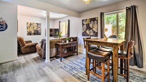 A spacious living room with a sofa, coffee table, and dining area. - Cozy Mtn-View Haven 20 Mi to Olympic Nat'l Park! (Port Angeles)