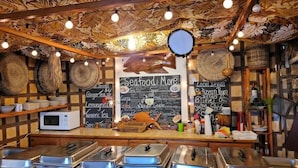 A buffet area with various food options and a chalkboard menu. - Groundfloor "Pat's Place" @ Sapphire Beach Resort (San Pedro)