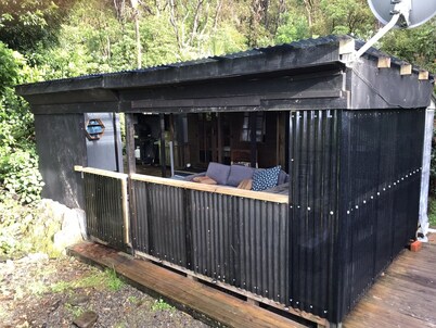 Cabins in the bush. Sea views and abundant native bird life.