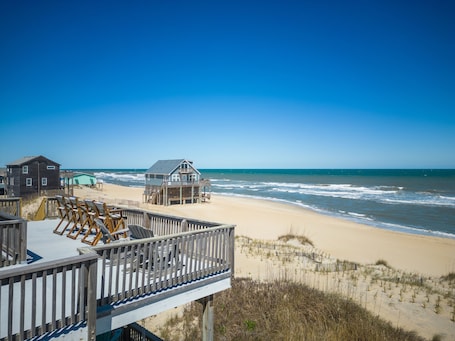 On the beach, sun loungers, beach towels. Oceanfront w/Hot Tub and Rooftop Deck - Panoramic Views!