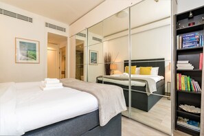 2 bedrooms, blackout curtains, iron/ironing board, bed sheets