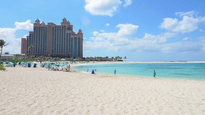 A beach with a large hotel in the background. - 2 Bedroom Lock-out - Harborside Resort at Atlantis - Full Resort Access (Paradise Island)