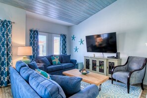 Condo, Multiple Beds, Patio (Turquoise Trea'shore) | Living area | 40-inch TV with cable channels - Flip Flops and Pop Tops by Silver Sands Vacation Rentals (Port Aransas)