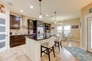 Enjoy meals in the kitchen with a central island and dining area.