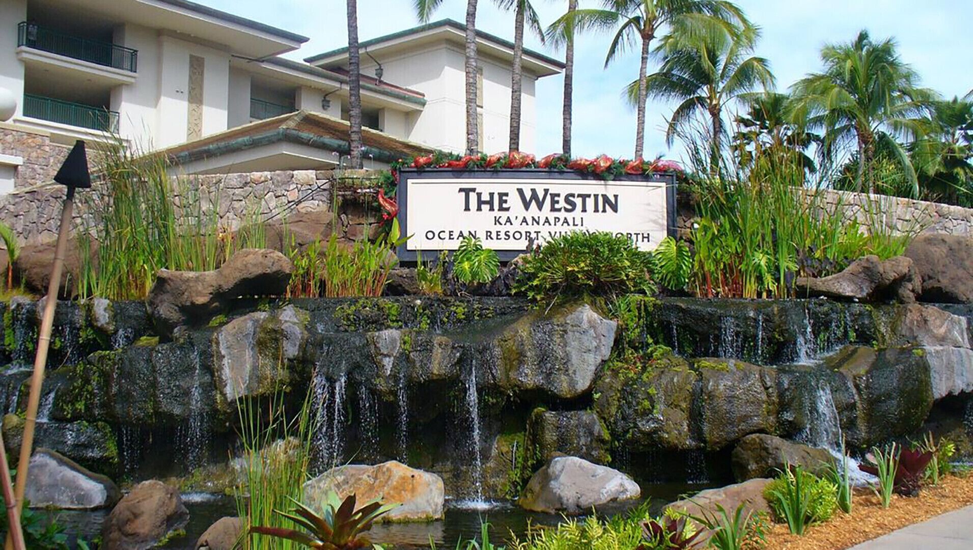 A sign for 'The Westin Ka'anapali Ocean Resort Village North' with a waterfall feature in front.