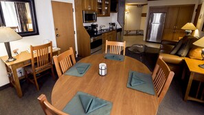 A compact hotel room with a dining area, kitchenette, and a living space. - 2 Bedroom - The Cliff Club at Snowbird - Full Resort Access (Snowbird)