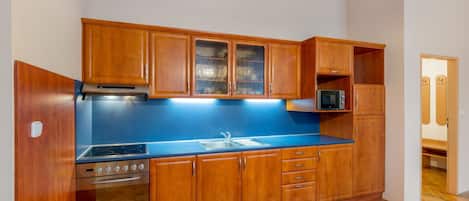 Microwave, oven, toaster, dining tables