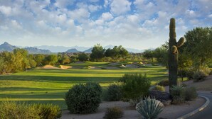 A golf course with sand bunkers, cacti, and a mountain range in the background. - Studio - Marriott's Canyon Villas at Desert Ridge - Full Resort Access (Phoenix)