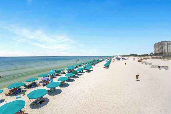 Enjoy a tranquil beachside retreat with access to a well-equipped beach area featuring umbrellas and sun loungers.
