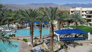 A resort with a swimming pool, palm trees, and a mountain backdrop. - 1 Bedroom - Marriott's Shadow Ridge II - The Enclaves - Full Resort Access (Palm Desert)
