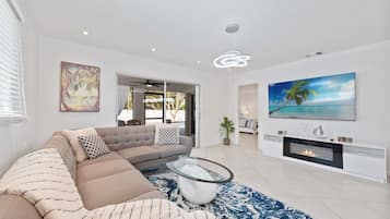 Smart TV, fireplace, books, offices