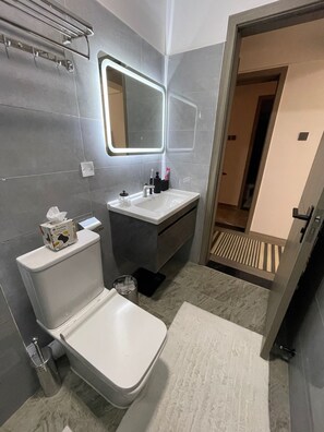 Shower, hair dryer, towels, soap