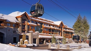 A ski resort building with a cable car, stone pillars, and snow-covered surroundings. - 1 Bedroom Deluxe - Located within Marriott's Grand Residence Club, Lake Tahoe - Full Resort Access (South Lake Tahoe)
