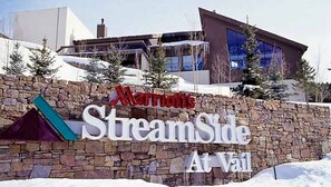 A stone wall with the text "Marriott's StreamSide At Vail" indicating a Marriott hotel location at Vail. - 1 Bedroom Loft - Marriott's StreamSide at Vail - Birch, Douglas, and Evergreen - Full Resort Access (Vail)