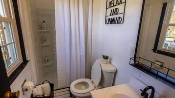 Combined shower/tub, hair dryer, towels, soap