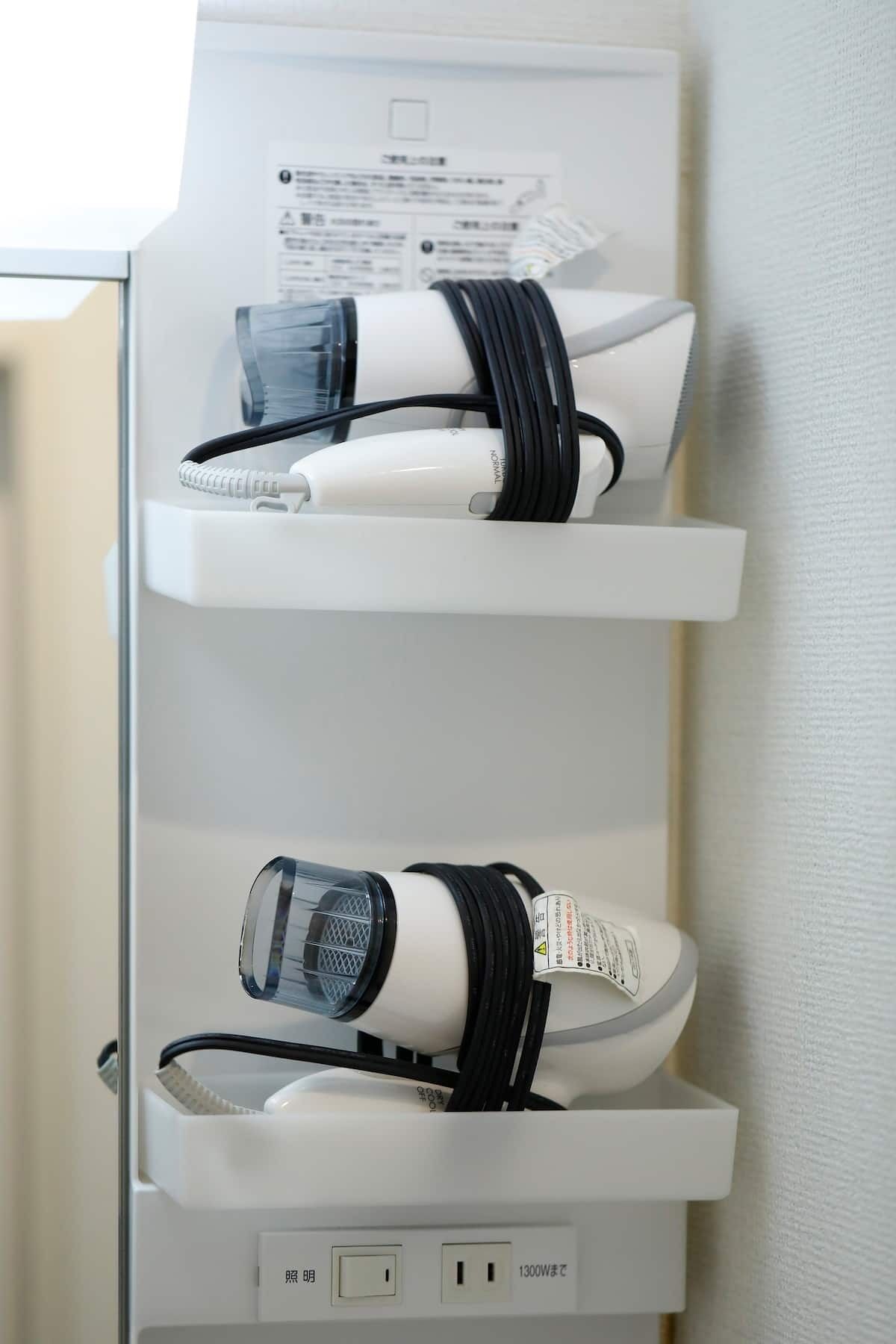 A white electrical outlet with two sockets, one labeled "OFF" and the other "ON".
