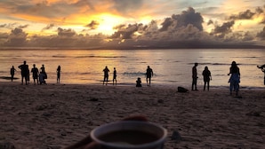 A beach scene with people and a sunset. - Purnima Resort Neil Island (Port Blair)