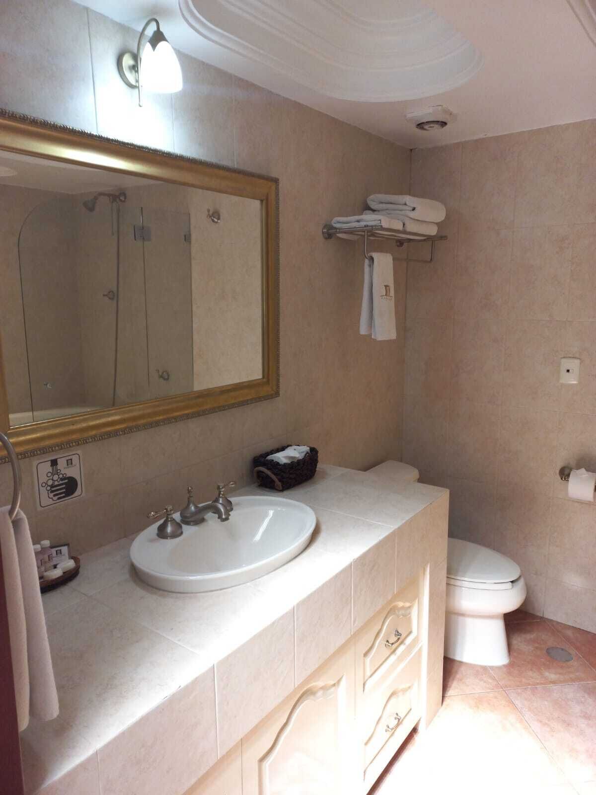deluxe room | bathroom | jetted bath, hydromassage showerhead, designer toiletries, hair dryer