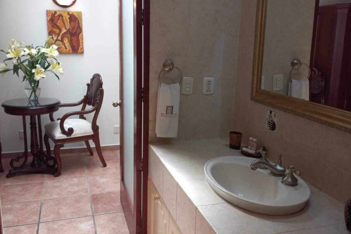 deluxe room | bathroom | jetted bath, hydromassage showerhead, designer toiletries, hair dryer