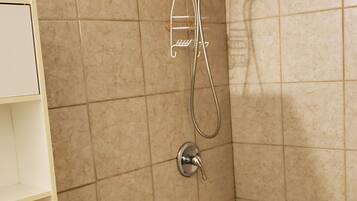 A bathroom with a bathtub, a shower, and a toilet.