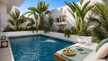 Outdoor pool, open 9:00 AM to 9:00 PM, pool loungers