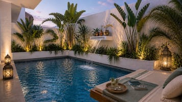 Outdoor pool, open 9:00 AM to 9:00 PM, pool loungers