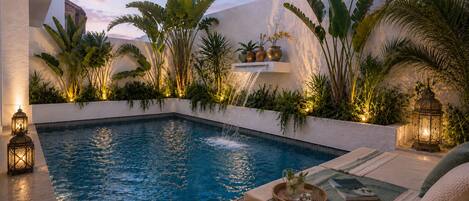 Outdoor pool, open 9:00 AM to 9:00 PM, sun loungers