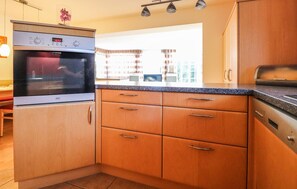 Fridge, stovetop, dishwasher, coffee/tea maker
