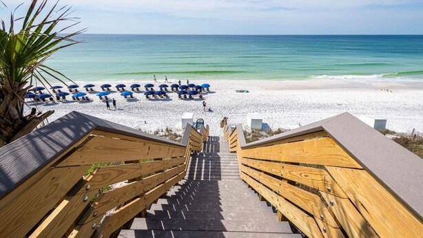 A wooden staircase leading to a beach with umbrellas and people. - L'escapade, Old Seagrove, Near Seaside, Private Heated Pool, Close to Beach (Seagrove Beach)