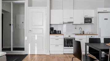 Exclusive Apartment | Private kitchen | Full-size fridge, microwave, oven, stovetop