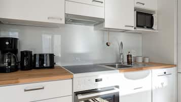 Exclusive Apartment | Private kitchen | Full-size fridge, microwave, oven, stovetop