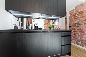 Comfort appartement | Privékeuken | Een koelkast/vriezer, een vaatwasser, een koffiezetapparaat/waterkoker