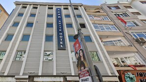 A multi-story building with a prominent sign for the Acar Suite Hotel. - Acar Suite Hotel (Istanbul)
