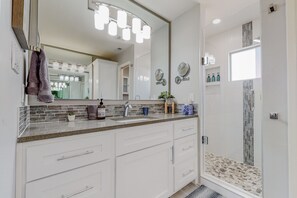 Combined shower/tub, hair dryer, towels, soap